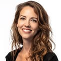 Smiling teacher in a classroom setting